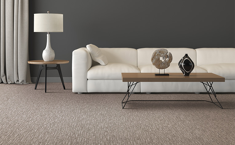 brown and white pattern carpet in living room